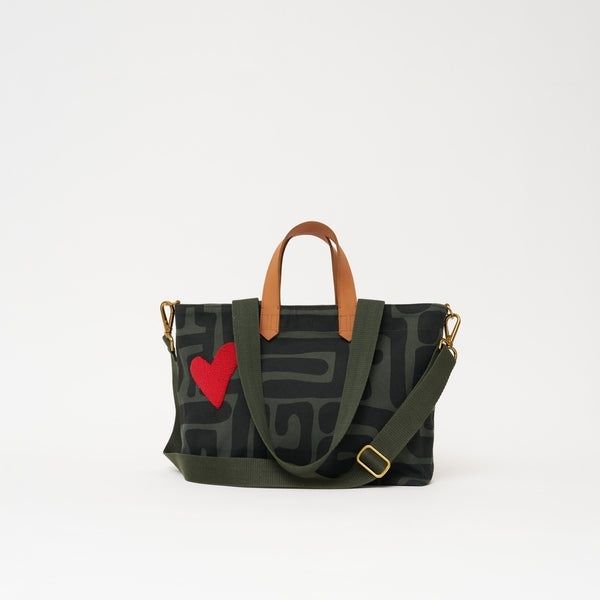 Dark patterned tote bag with red heart and shoulder strap